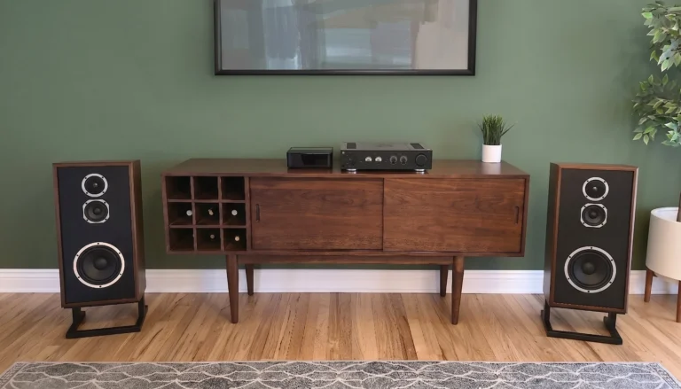 Pair of KLH Model Four loudspeakers flanking a stereo console in a living room.