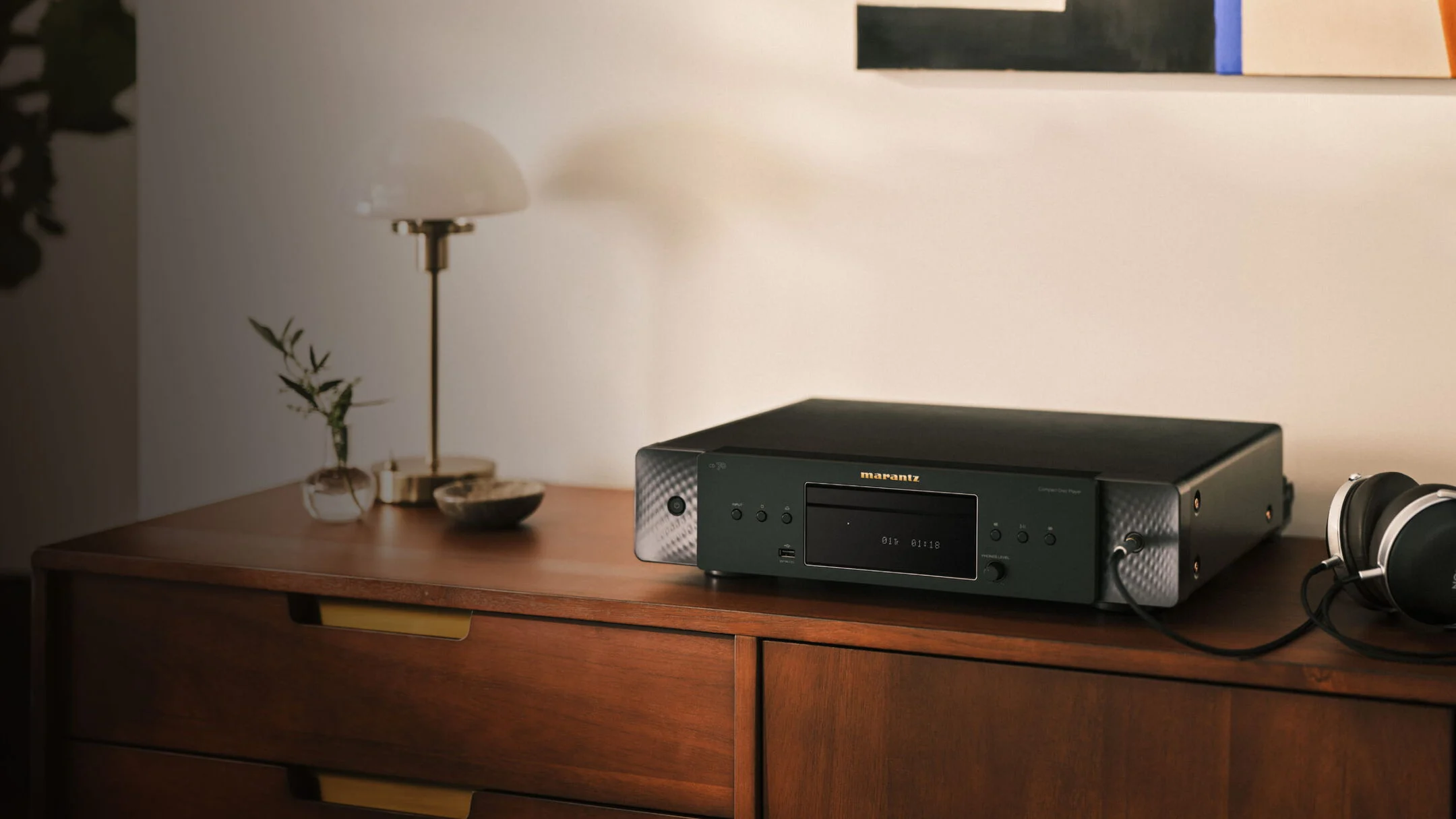 Marantz CD 70 CD player on a wood cabinet with headphones