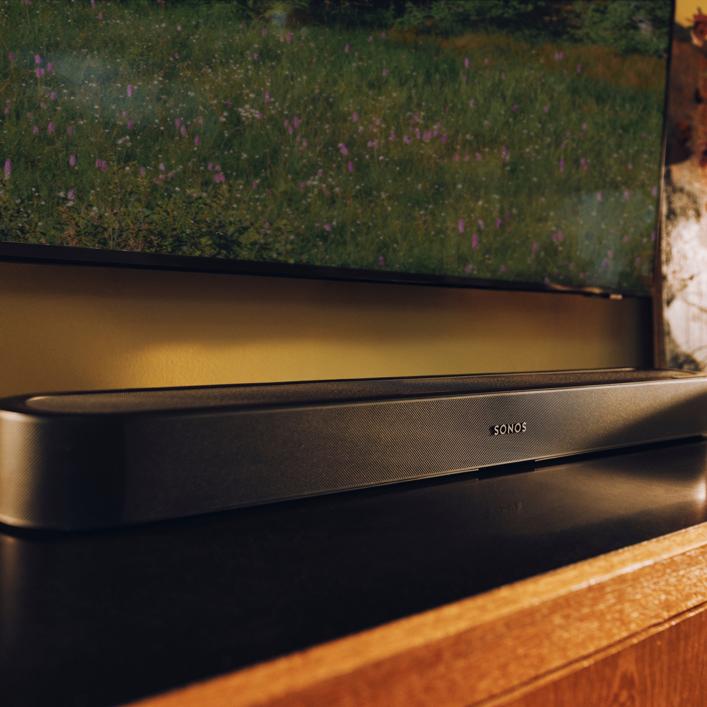 Black Sonos Beam Ultra soundbar beneath a television.