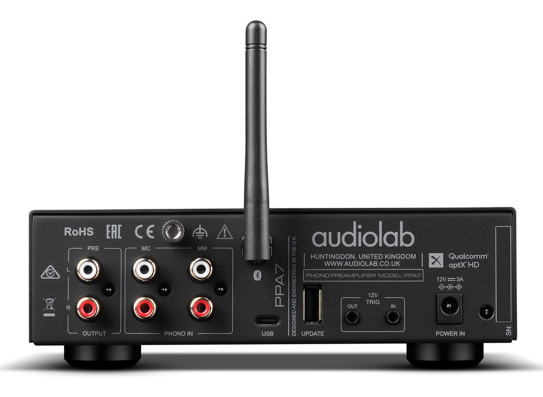 Rear panel view of the black Audiolab PPA7 showing separate MM and MC RCA inputs, ground post, RCA pre-out, USB-C recording output, Bluetooth antenna, and 12V trigger jacks