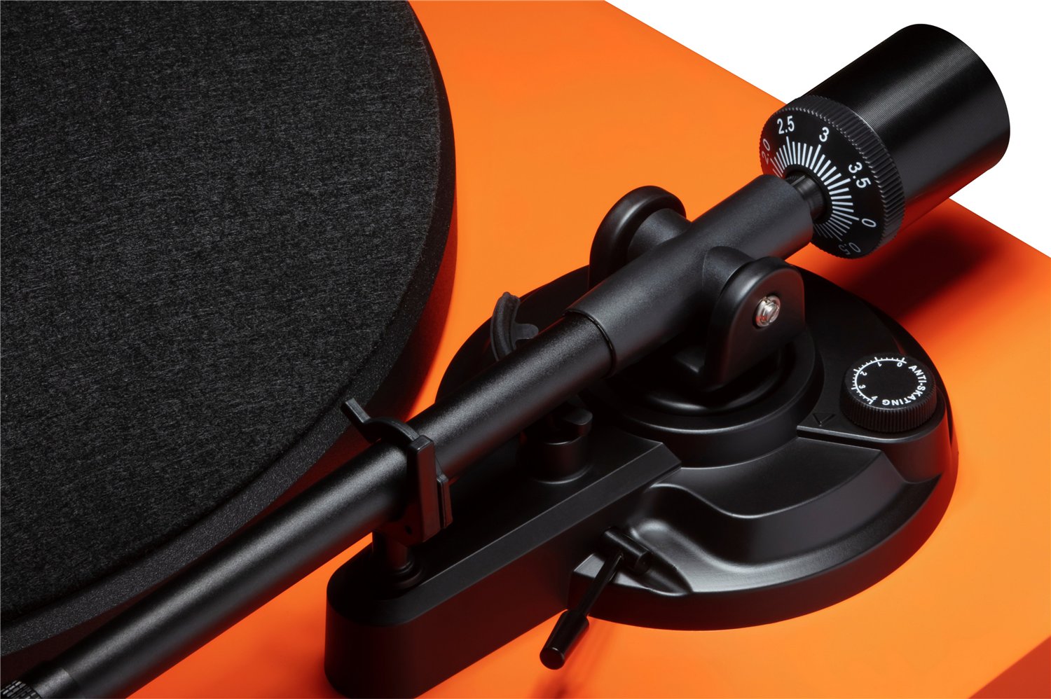 Close-up of the Orange Cambridge Audio Spira straight aluminum tonearm, removable headshell with Audio-Technica AT3600L cartridge, cueing lever, anti-skate dial, and counterweight