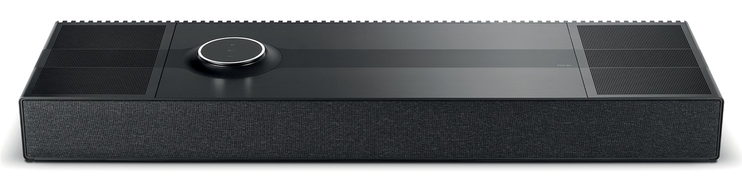Focal Mu-so Hekla wireless 7.1.2 speaker system on a dark console table showing the brushed aluminum top with circular volume dial and perforated front grille