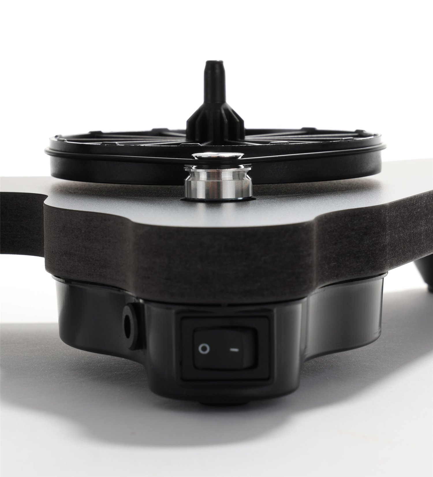 Close-up of the Rega Replay rear 24V synchronous motor module, CNC-machined stepped aluminum pulley, and EBLT drive belt