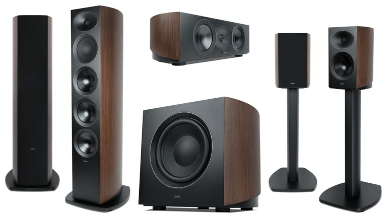 Revel Performa4 Series loudspeakers in Natural Walnut veneer including the F346 3-way floorstanders on the left, C245 center channel and B140 10-inch subwoofer in the center, and M146 bookshelf speakers on MFS4 floor stands on the right