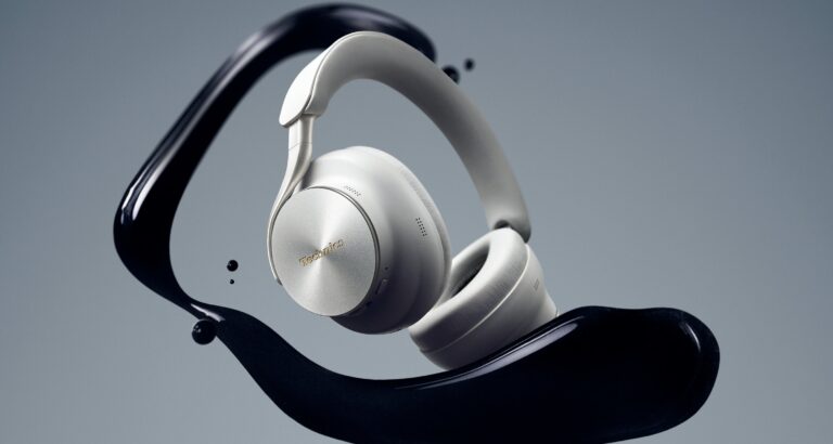 Technics EAH-A1000 flagship wireless noise-canceling headphones in Platinum Greige finish showing circular-machined aluminum earcup plates and gold Technics logo